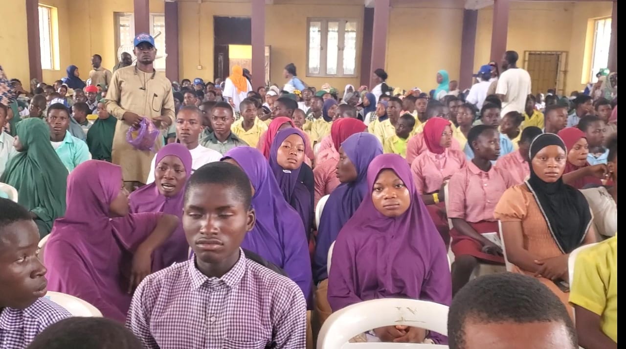 Osun students receiving UTME and WAEC forms